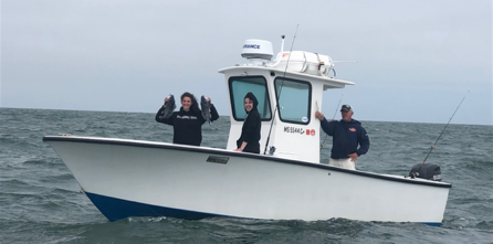 Ali J with captain and passengers