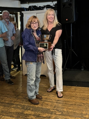 Ladies fishing tournament winner holding her prize